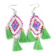 Arete artesanal con chapa de oro, bordado chiapaneco y tres motitas de hilo en varios colores
